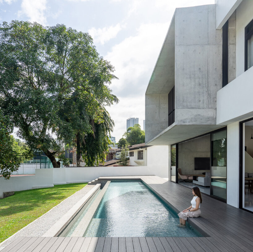 vast shuttered wall blurs thresholds at fabian tan's concrete house in kuala lumpur 
