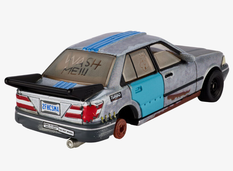 one tire is missing, replaced by a rusted wheel hub