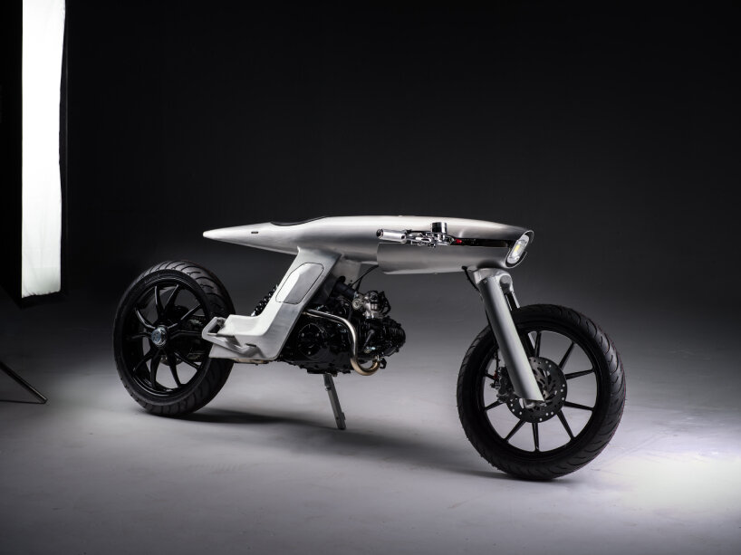 the tank is fused to this brushed aluminum frame, engineered and manufactured from scratch