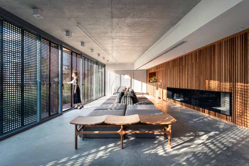 the party hall is open to the sidewalk, favoring a Jane Jacobs' 'eyes on the street' approach to the condominium areas