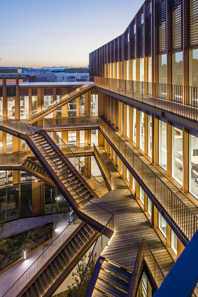 from the entrance, double-height halls connect the urban space to the building’s interior