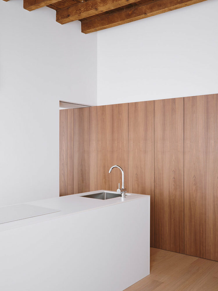 the kitchen area is integrated into the overall design