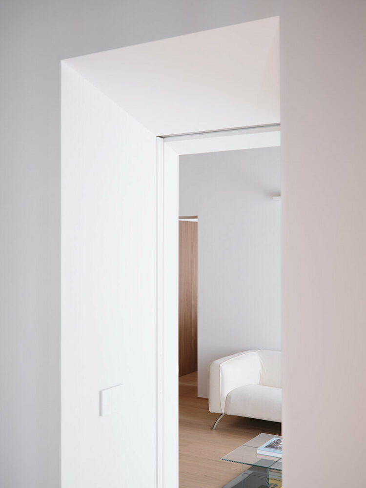 carefully placed lighting enhances the apartment’s architectural features