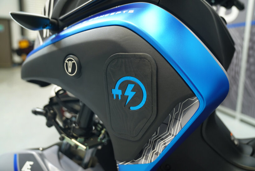 charging port sharing the same color as the motorcycle's body