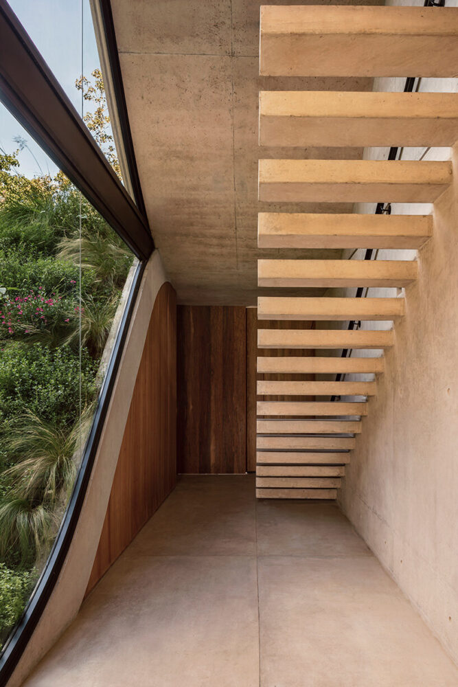 envisioned as a refuge on the slope of a golf course 