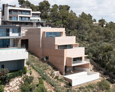 pedro cardigo captures álvaro siza's casa colien, a stepped concrete volume in hilly barcelona