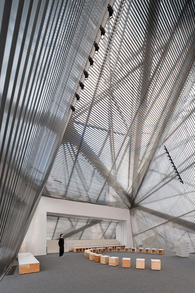 DJI Horizon Hall, a 15-meter-high space where natural light filters through the added skin