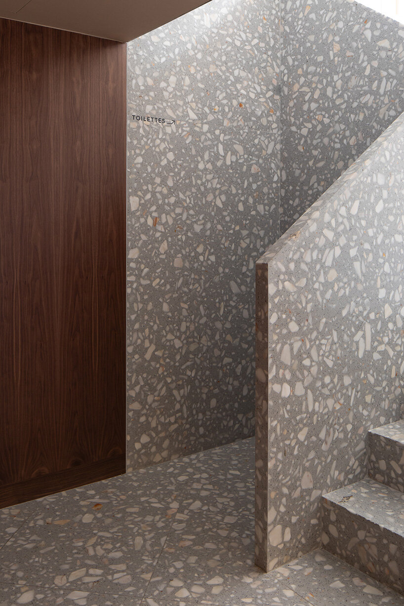 upstairs, visitors find a cozy room that continues the use of dark wood tones