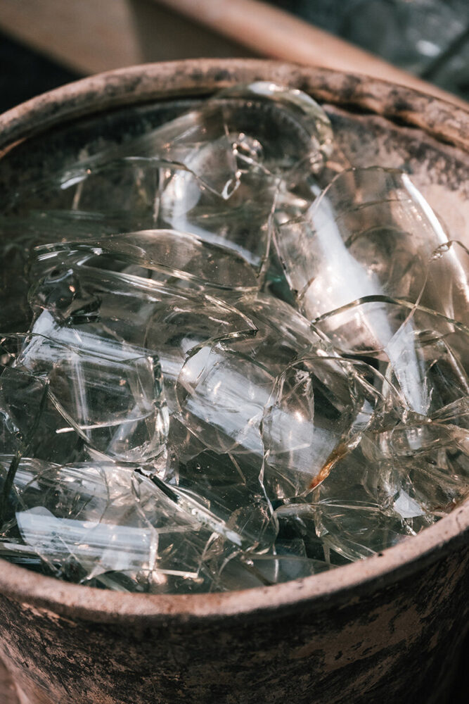 recycled wine bottles are embedded in the glass walls