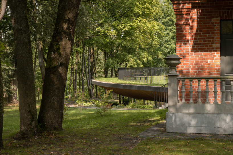 PUPA revitalizes historic red-brick manor in lithuania as contemporary art center