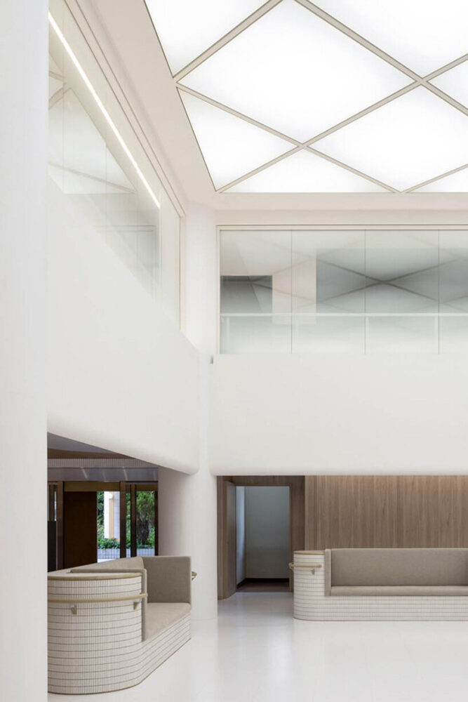 MOMENT Inc. places glass panels in the atrium