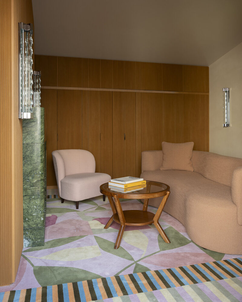 round sofas in pink and burgundy hues