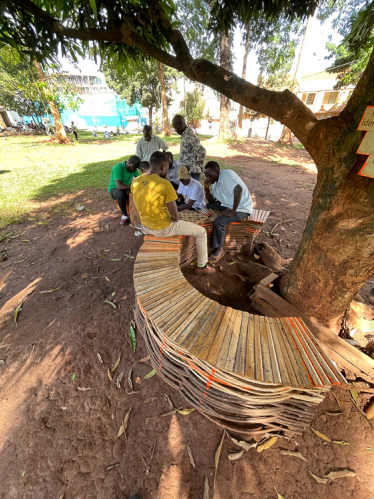 a setup of the curved benches around a tree