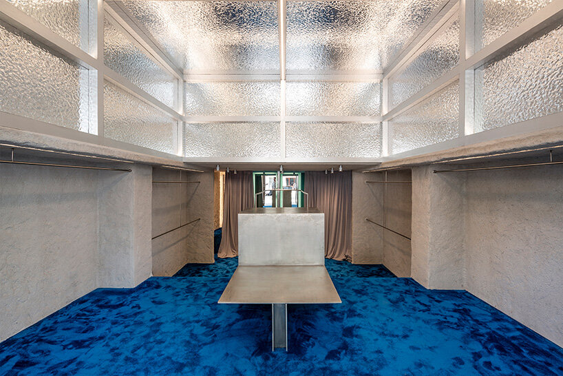 the metallic double-height ceiling pays homage to the American Bar by Adolf Loos