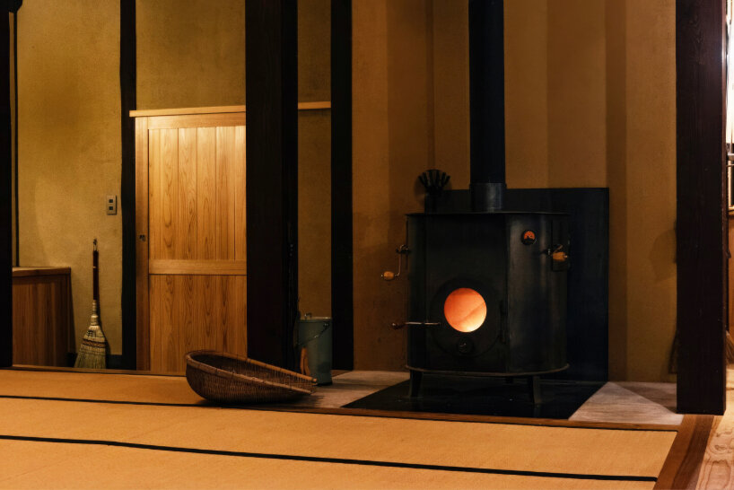 wooden furniture complements the iron, and the steel plates around the stove adding an austere look