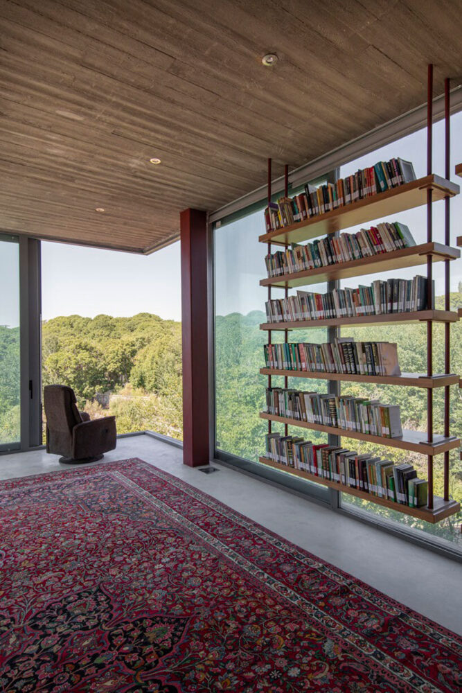 a vibrant Bakhtiari rug adds warmth and texture to the villa’s minimalist interior design