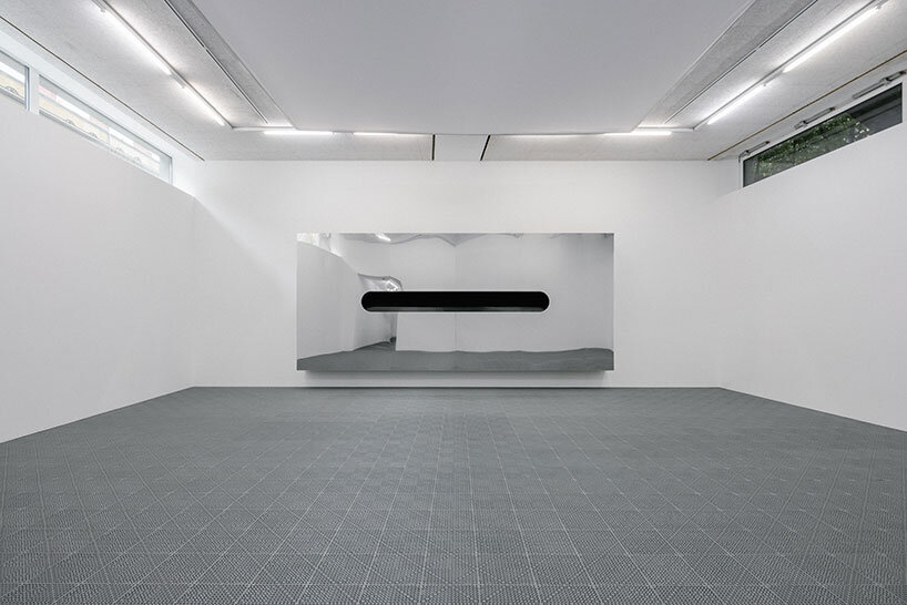 white foam envelops underground gallery in harry nuriev's debut solo show at berlin art week