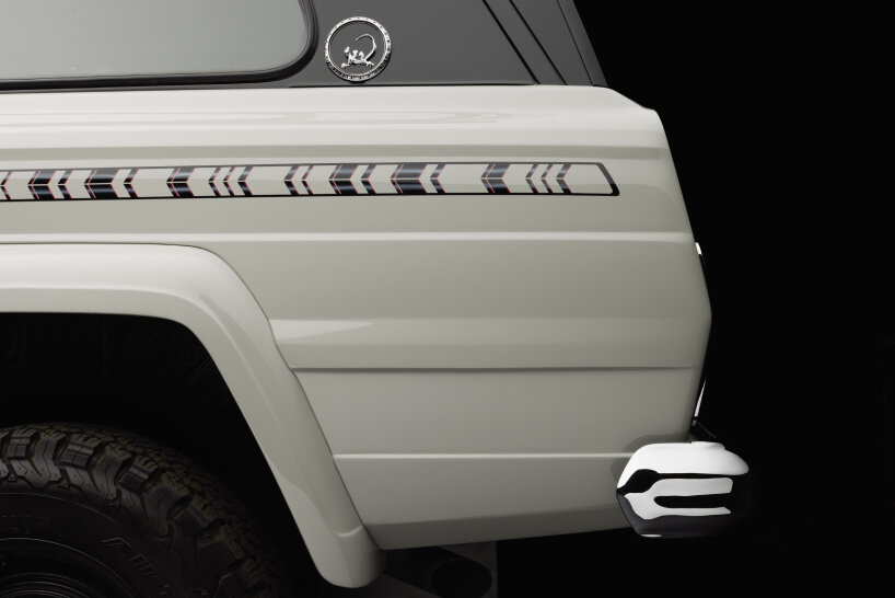 detailed view of the hand-painted graphic of eagle feather in black and blood red