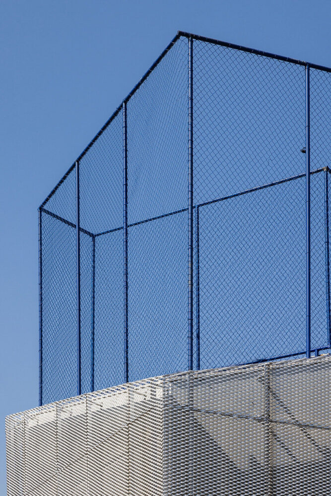 classrooms and sports court are elevated to maximize openness on the ground floor