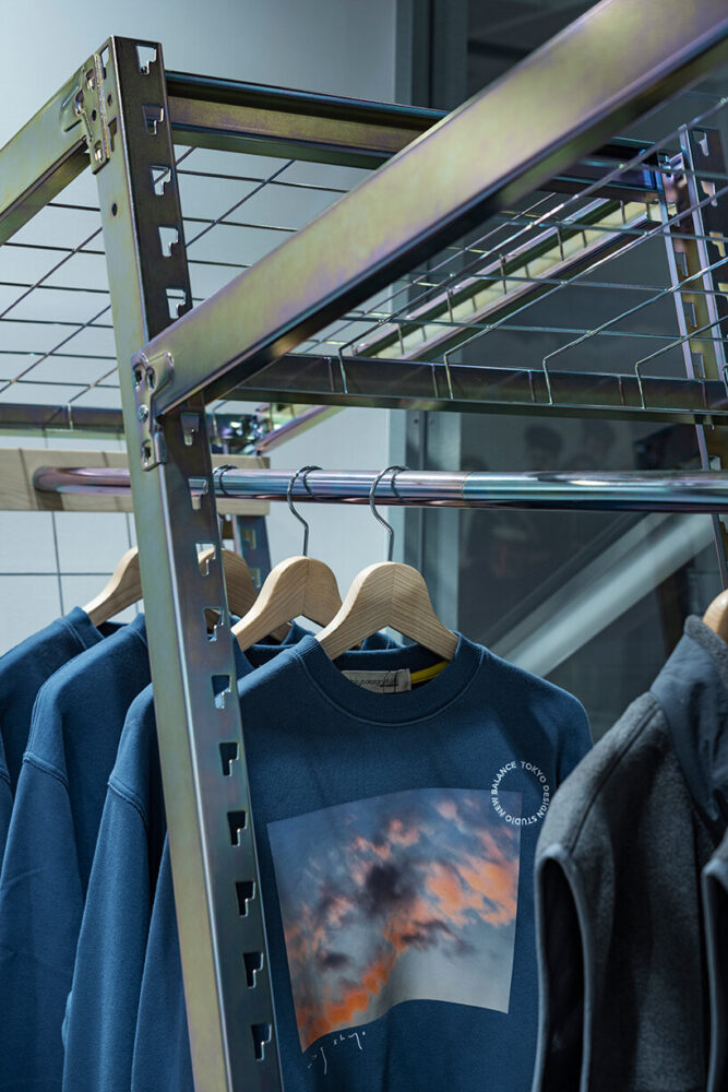 the chromate-treated finish, inspired by blurred photo prints, adds a dynamic aesthetic to the clothing display