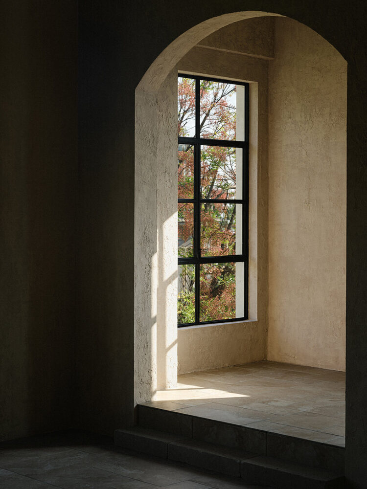skylights and large windows allow sunlight to filter into the space