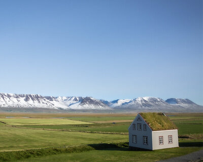 curro cardenal's photo series captures isolated homes scattered onto iceland's rugged land
