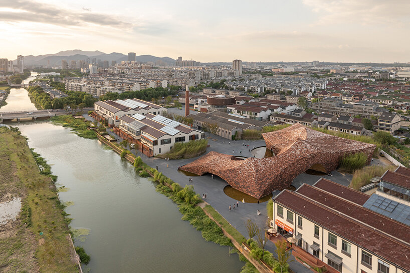 kengo kuma wraps undulating clay museum in ceramic panels