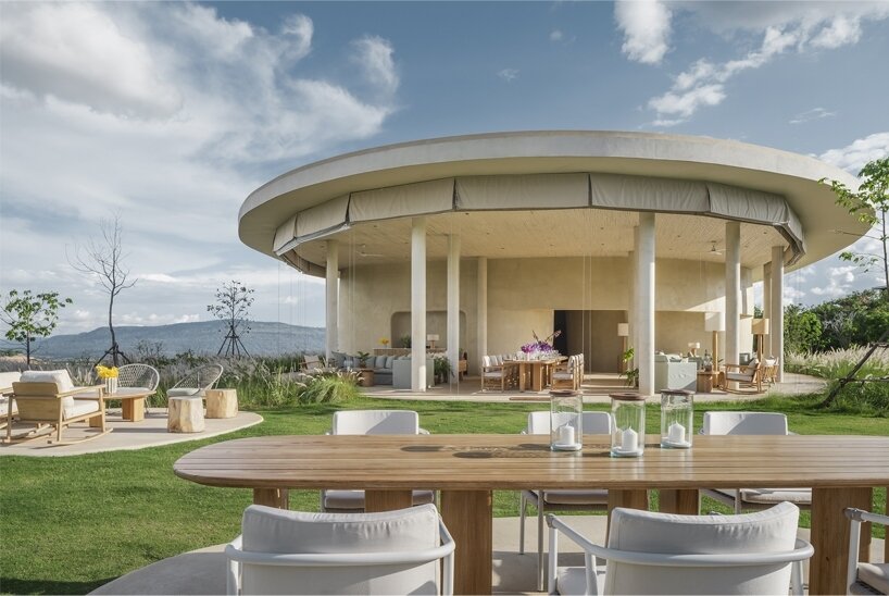 custom oak furniture echoes the natural curves of the site