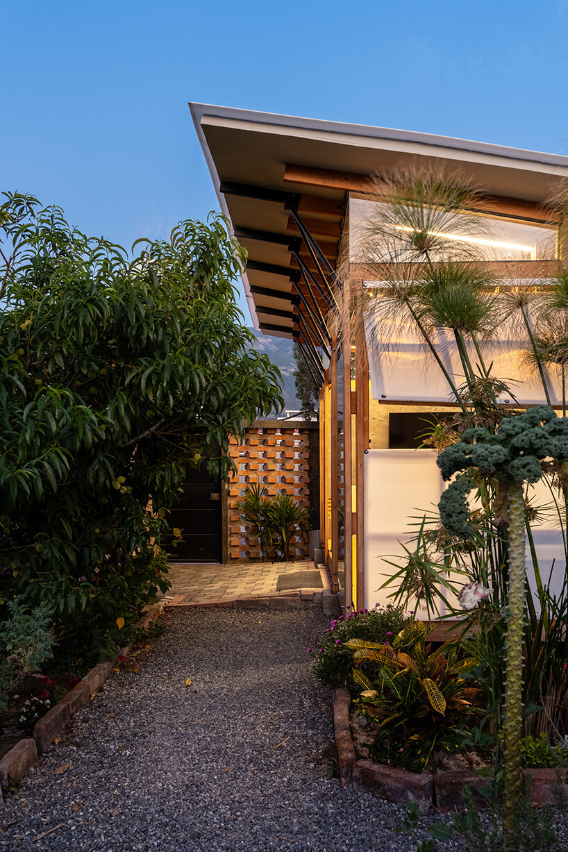 a single open space where the roof acts as a key structural and symbolic element