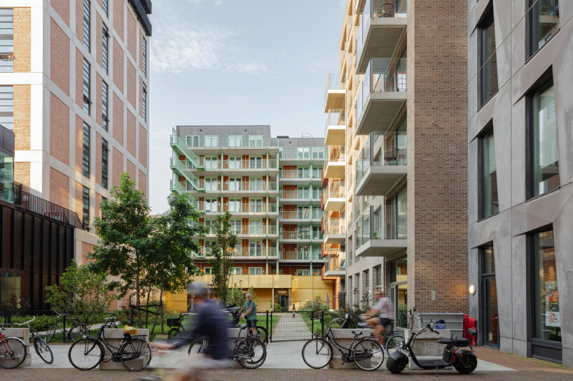 studioninedots' oostenburg island replan blends industrial heritage with urban density