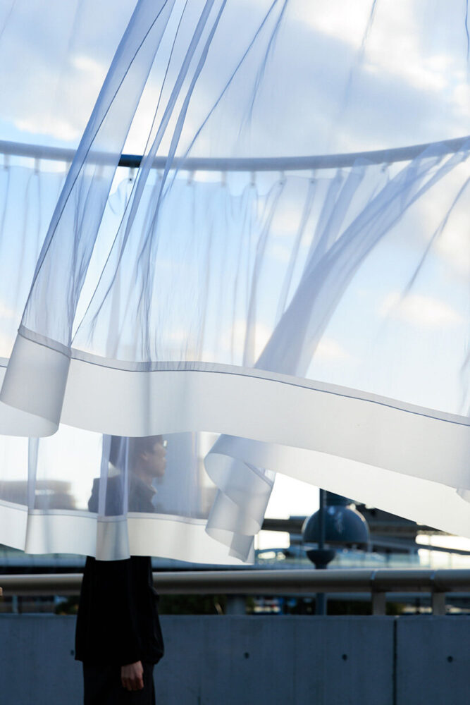 appearing bright and opaque under strong midday sun, yet more transparent on cloudy days