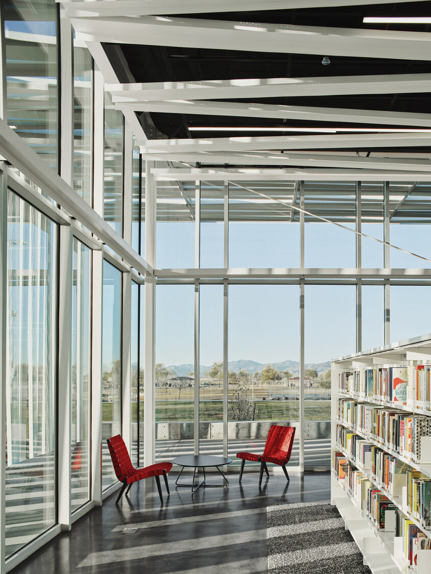 the open reading room and glazed study spaces frame sweeping views of the White Tank Mountains