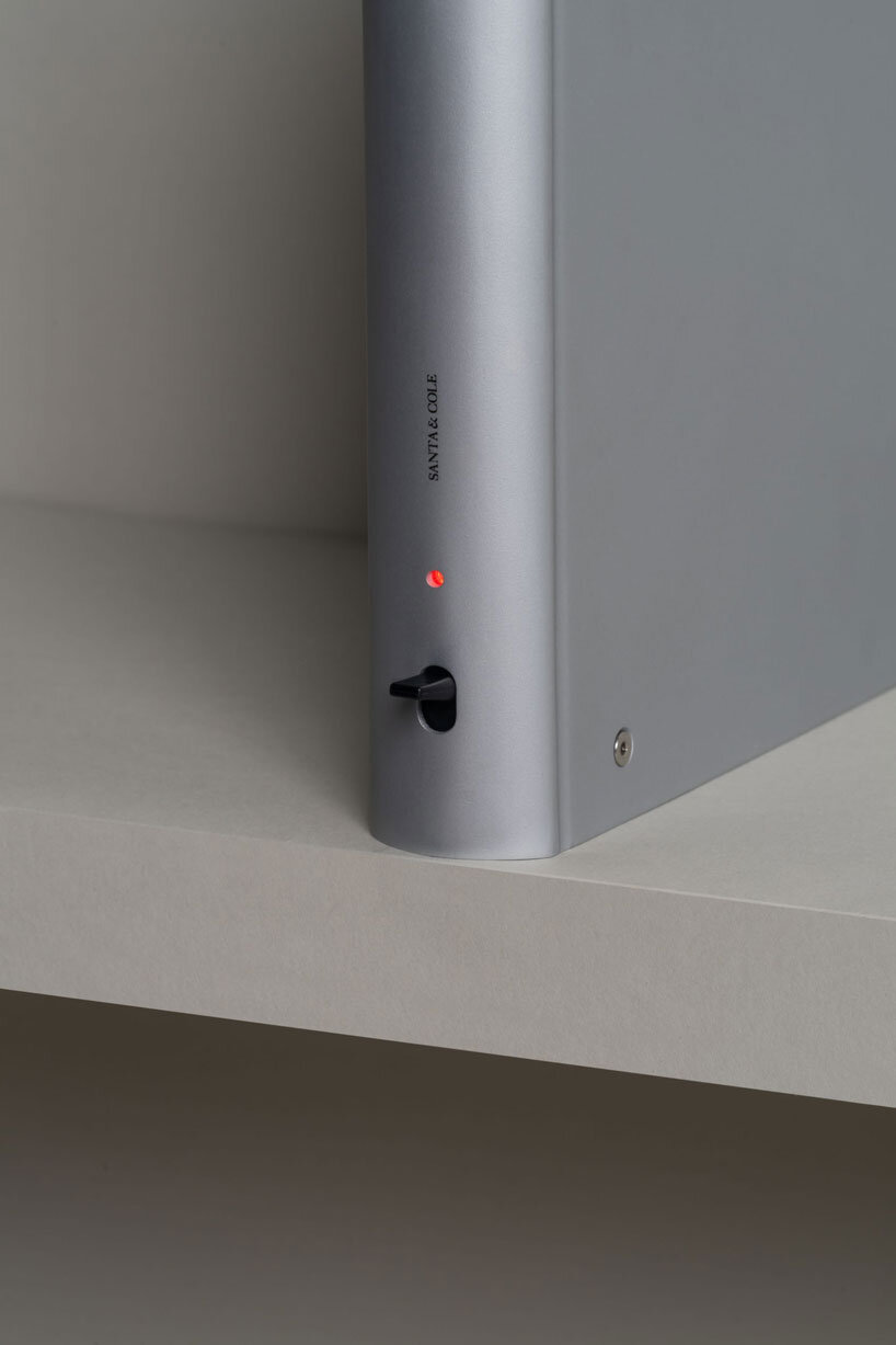 shaped like a book, oscar tusquets' bib luz lamp discreetly integrates into any shelf - 7