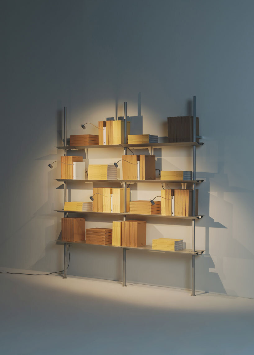 shaped like a book, oscar tusquets' bib luz lamp discreetly integrates into any shelf - 6