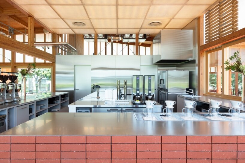 cluster of intimate wooden huts shape blue bottle café in tokyo park