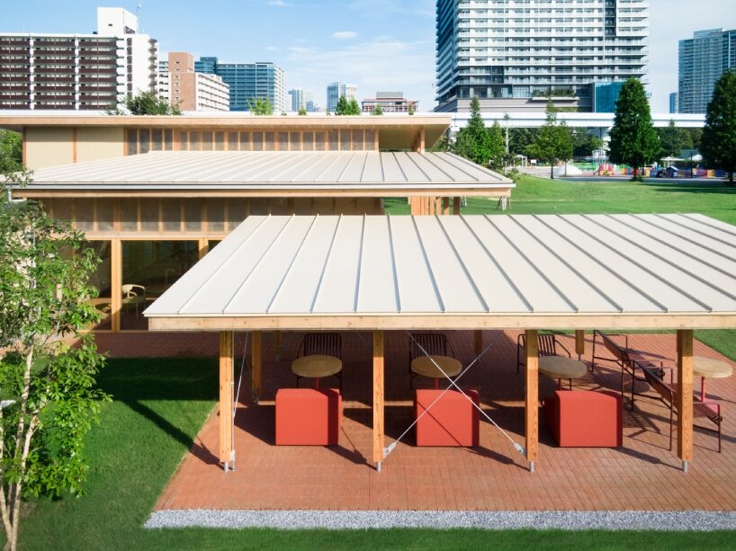 cluster of intimate wooden huts shape schemata architects’ blue bottle café in tokyo park