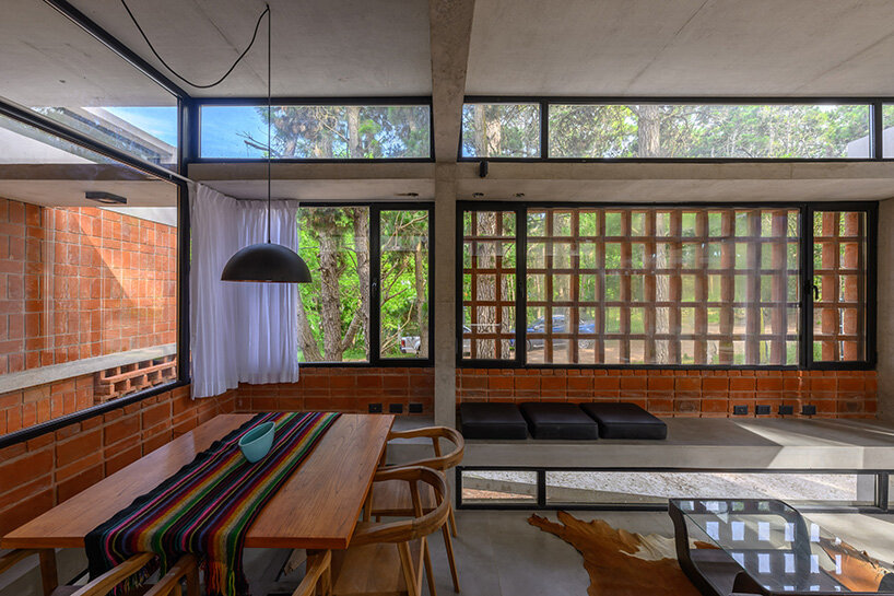 interlocking bricks that condition sunlight, frame views, and form versatile living spaces