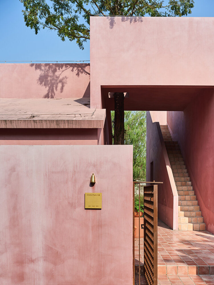 the entrance garden is paved with bluestone slabs
