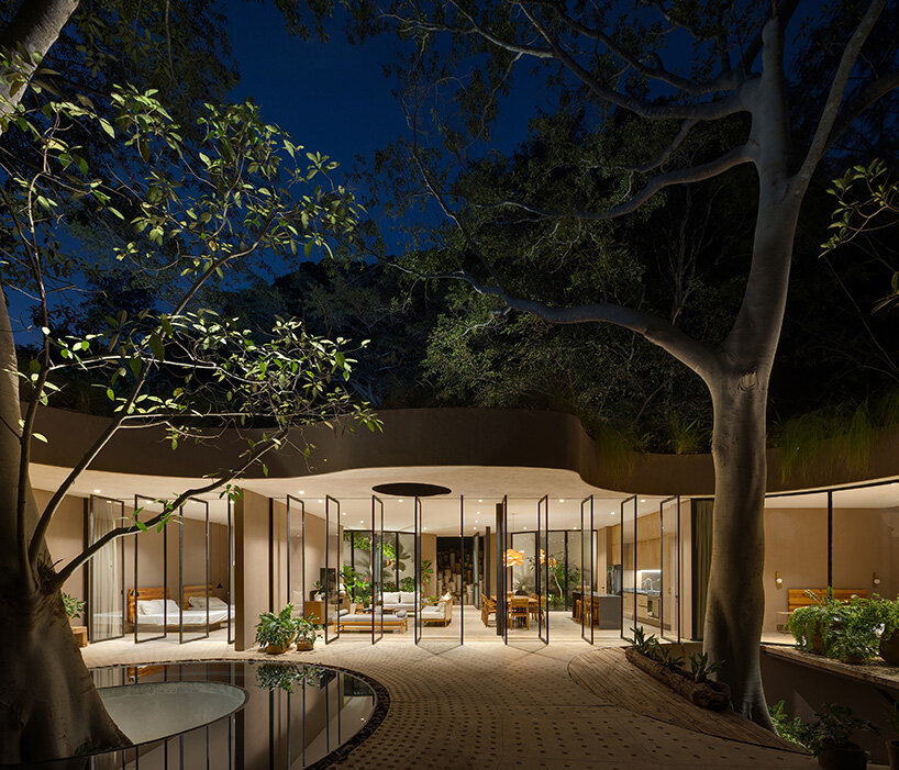 a terrace with a circular pool overlooking the lake