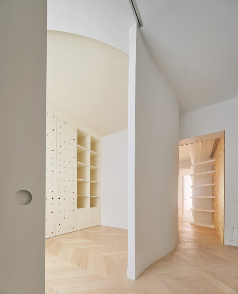 the central bookcase acts as a transitional space