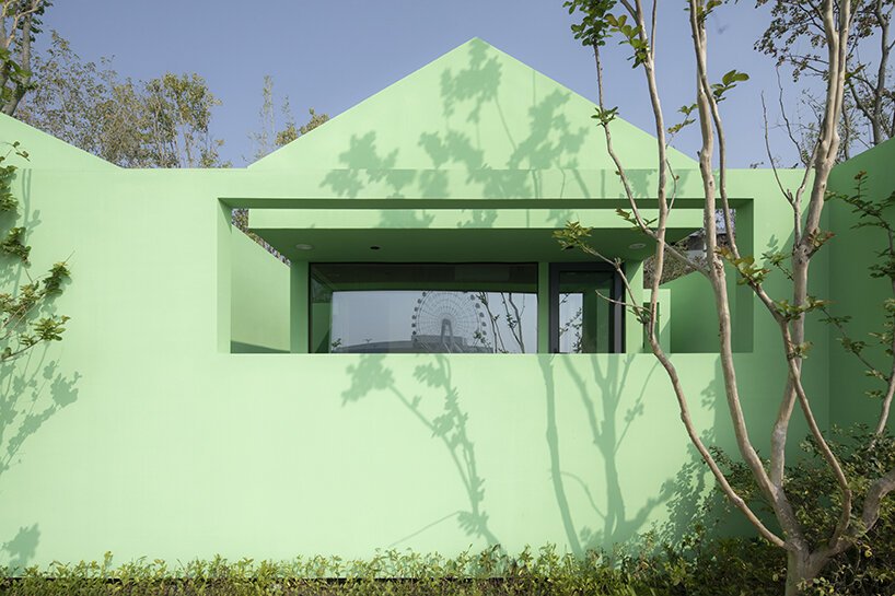floor-to-ceiling windows and skylights frame views of the lake and sky | image by Arch EXIST