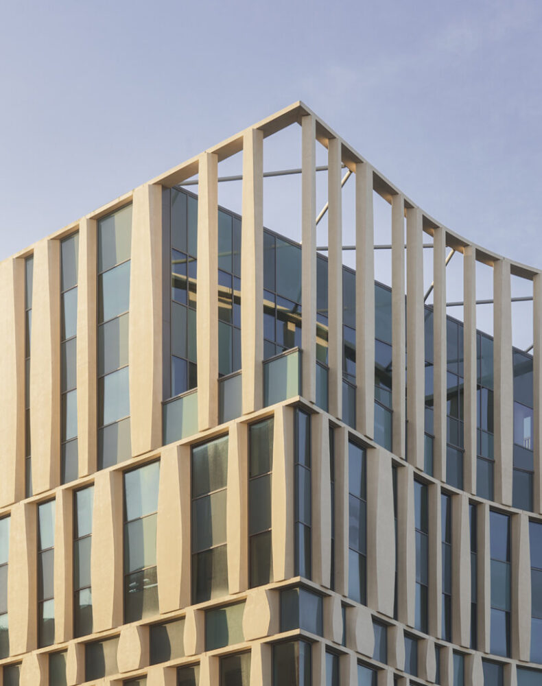 shorter facades curve inward with soft concave forms