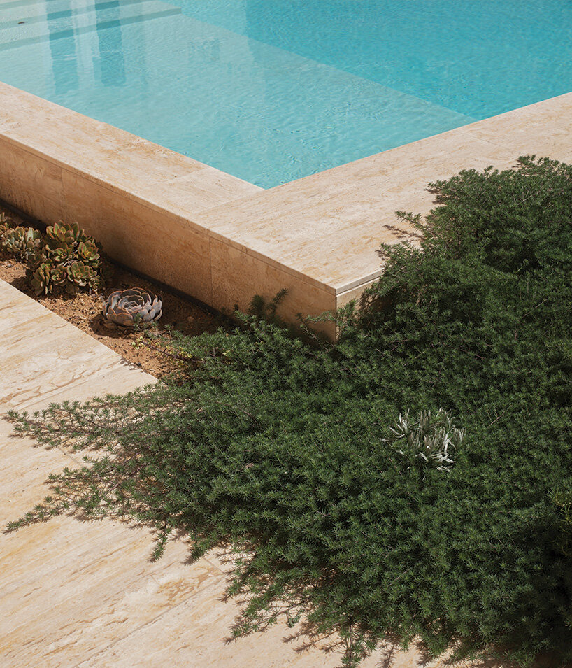 framed by old stone walls and Mediterranean fruit trees