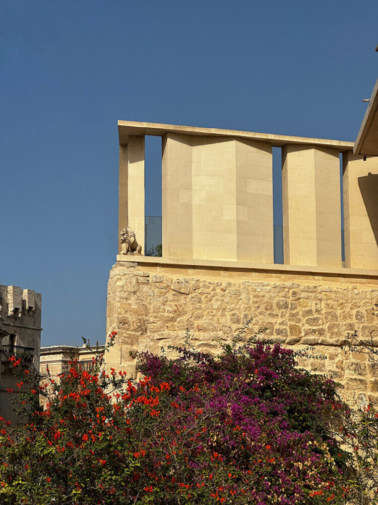 sculpted with undulating fins that vary in angle and spacing, the screen filters natural light