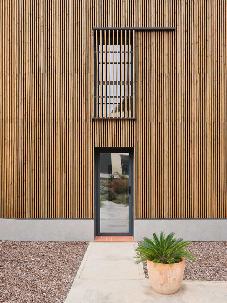 sliding wooden shutters that regulate light 
