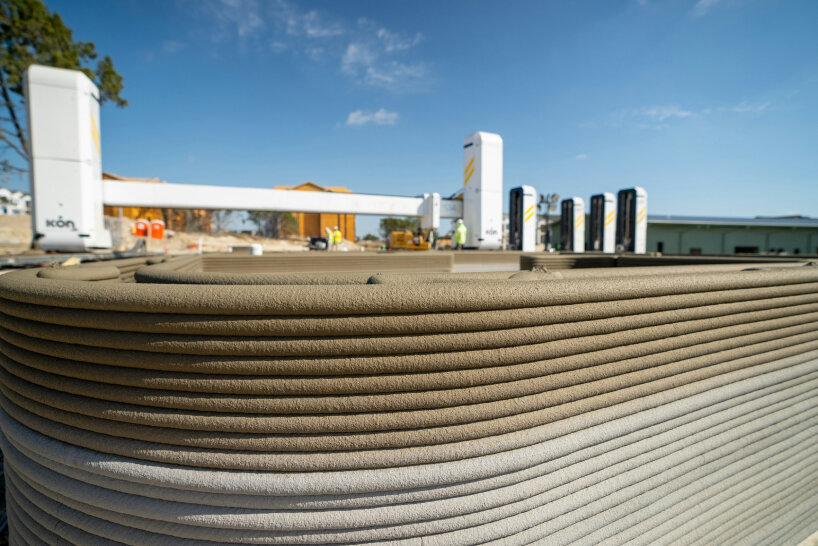 a fleet of robots leads the construction of the additional homes