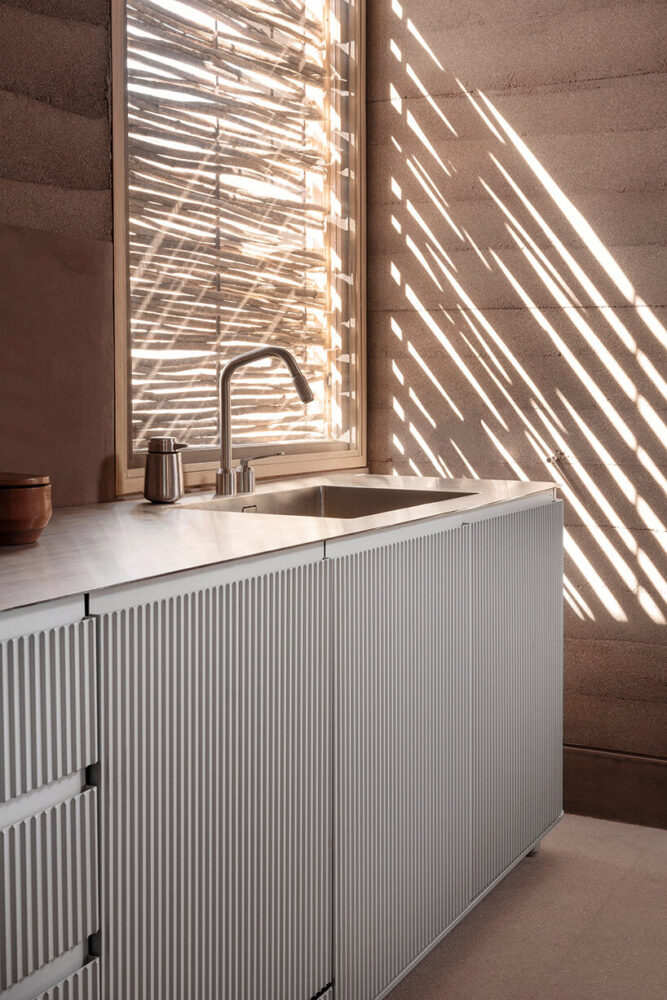 at the heart of the open-plan living space is Vipp’s anodized aluminum V3 kitchen