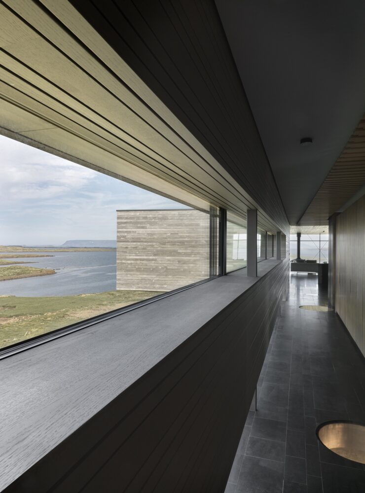 four glazed floor windows in the corridor connect residents visually to the earth below