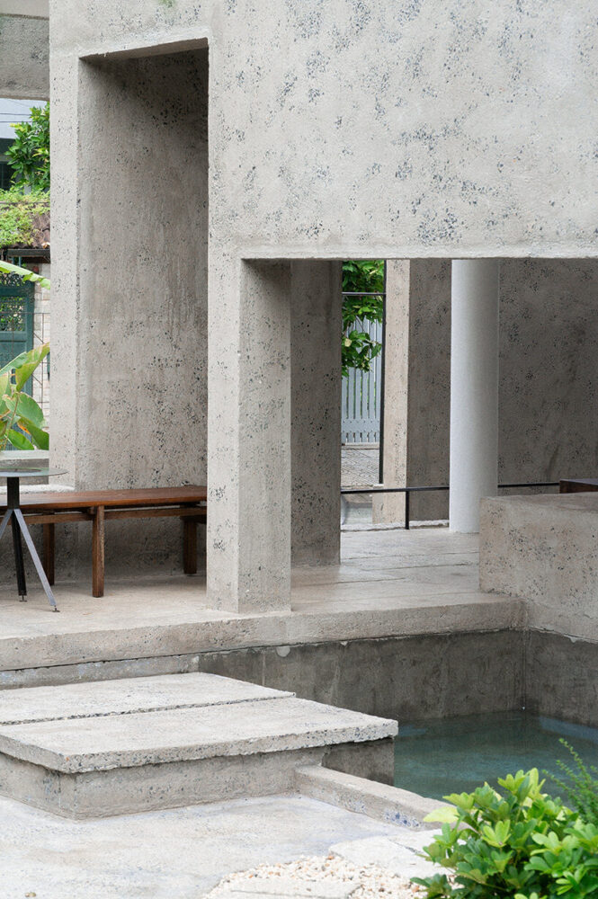 tall perimeter walls—often exceeding the legal height of 2.6 meters—define the urban fabric