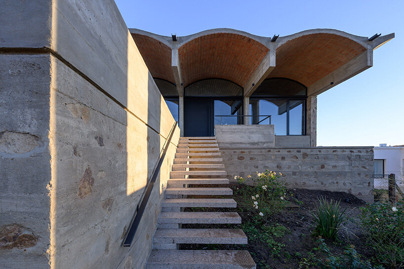 combining sturdy walls and vaulted ceilings with a contemporary look to architecture